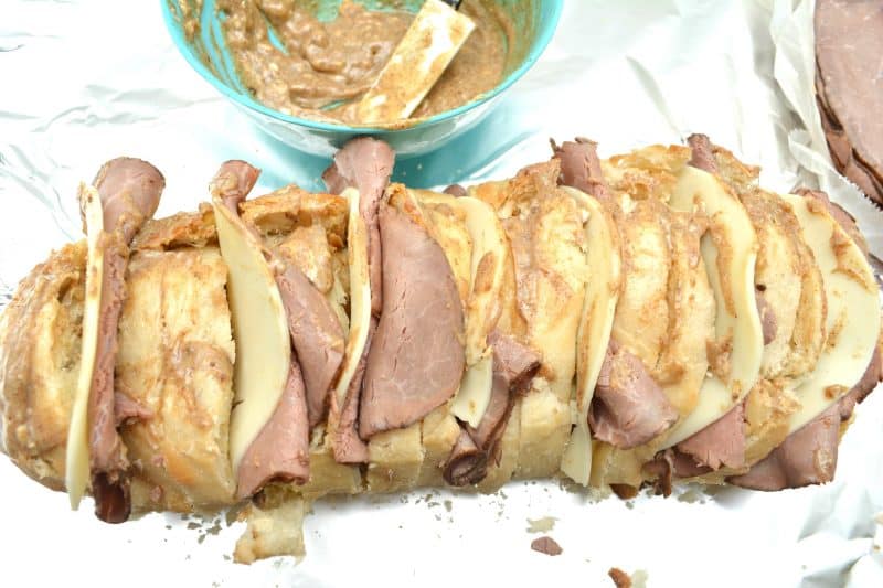 Place roast beef and cheese slice between every other slice of bread.