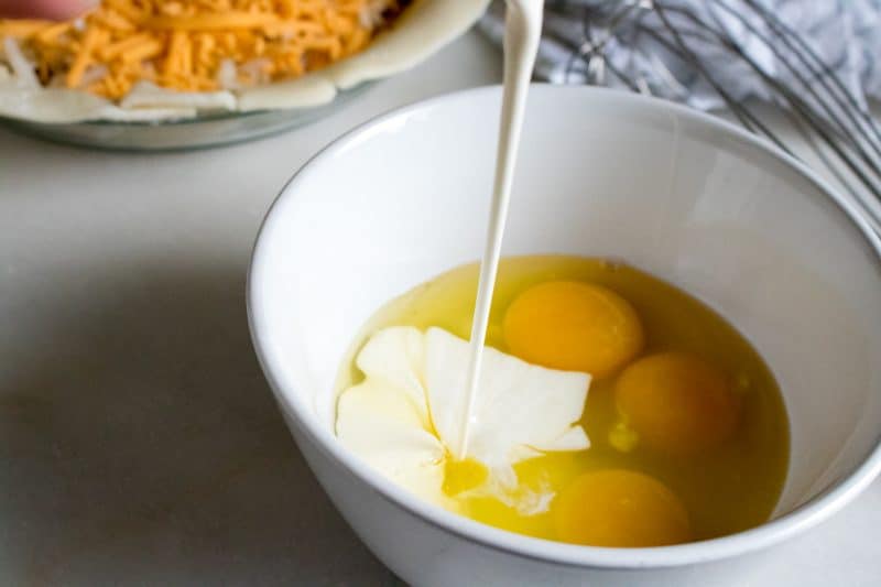 Place your eggs, milk, salt, and pepper in a medium bowl.