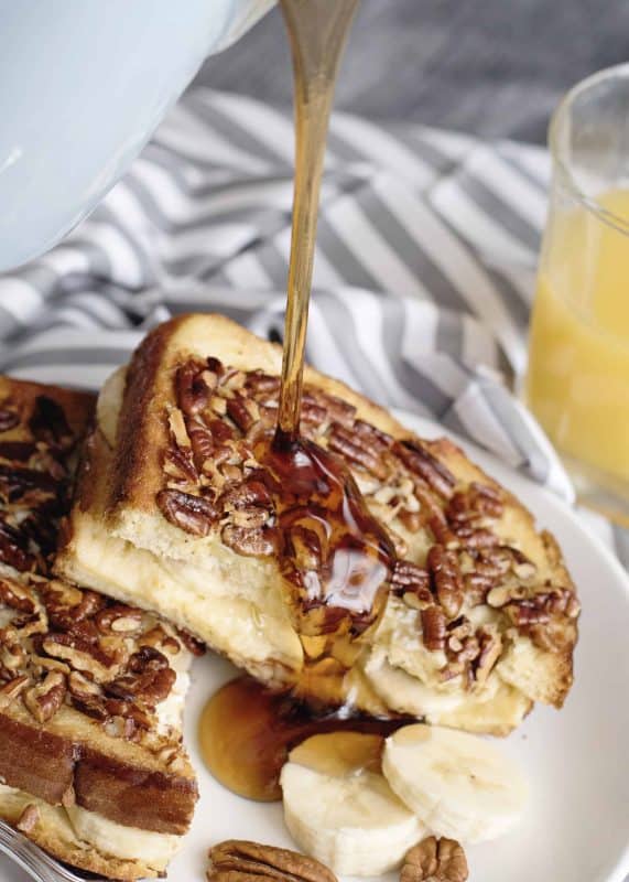 Drizzling syrup over Banana French Toast.