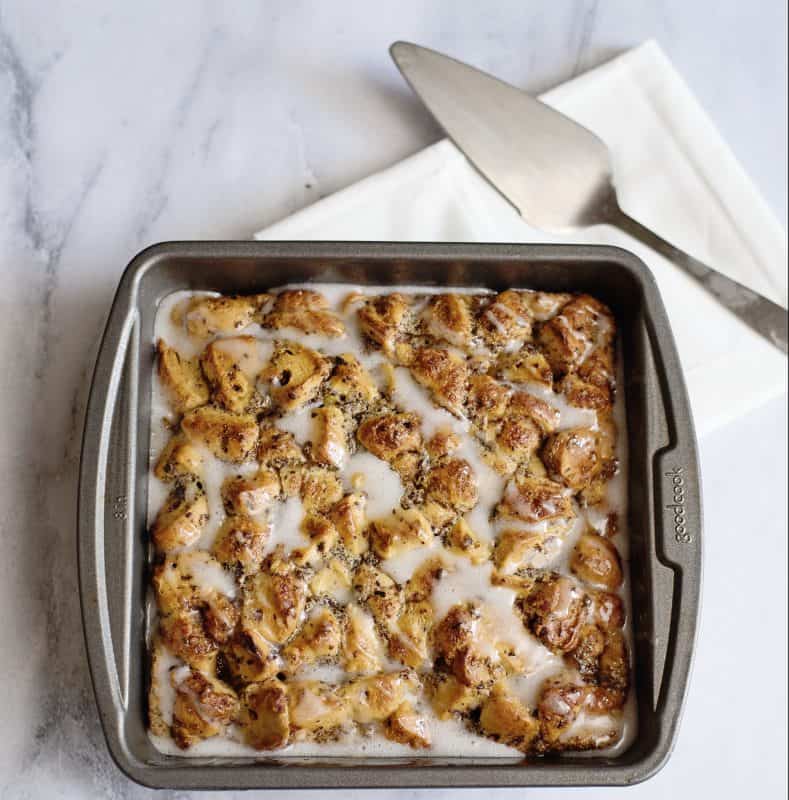 Baked Cinnamon Roll French Toast Casserole topping with icing.