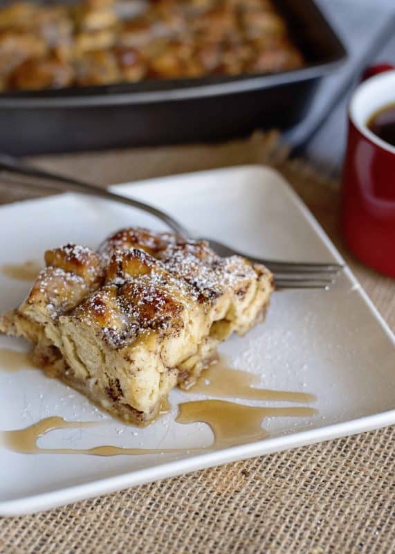 A piece of Cinnamon Roll French Toast Bake on a plate.