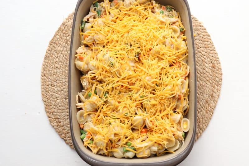 Top casserole with cheese and bake until cheese melts.