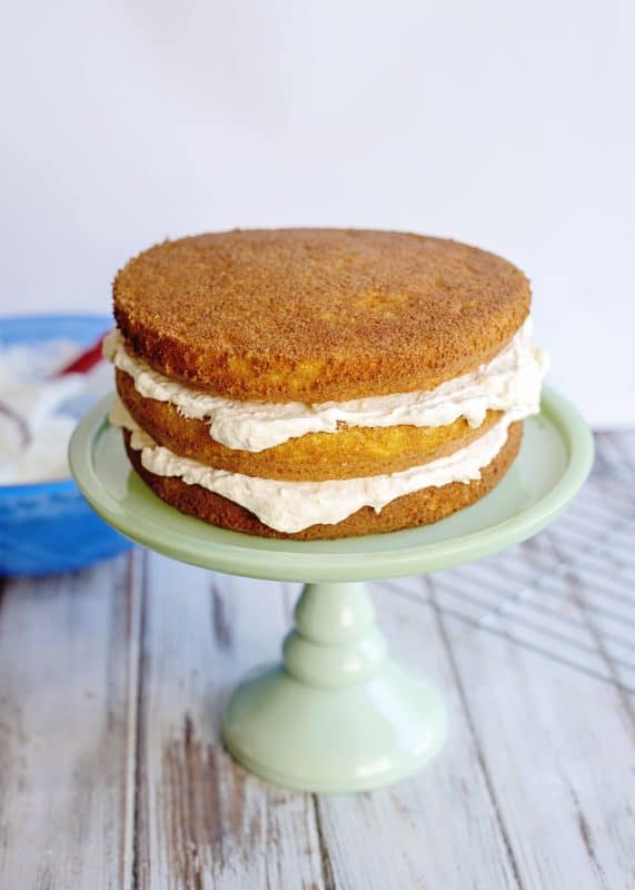 Add icing between each layer of mandarin orange cake.