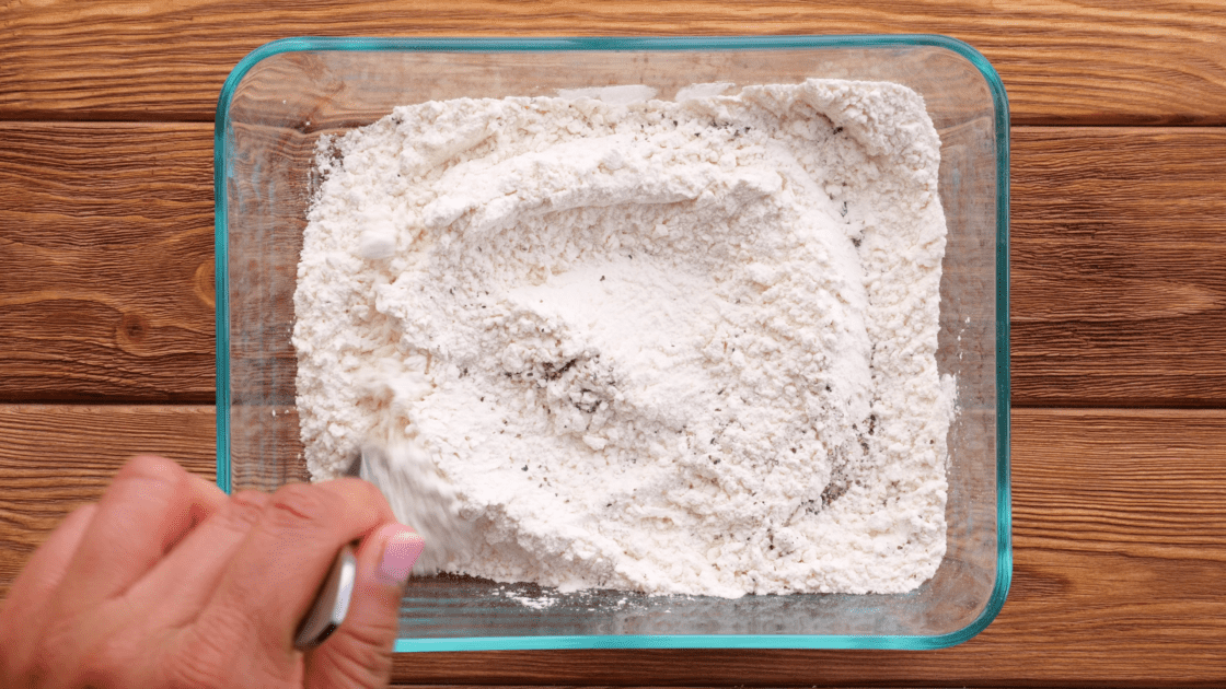 Mix together flour, salt, and pepper in shallow dish.