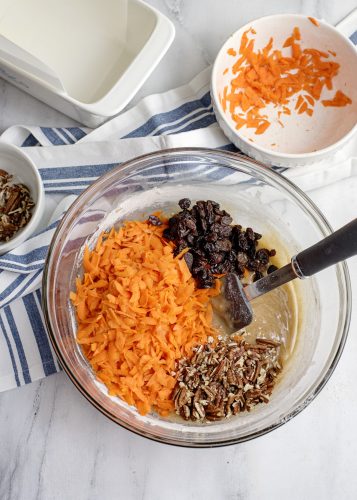 Fold in the carrots, raisins, and pecans.