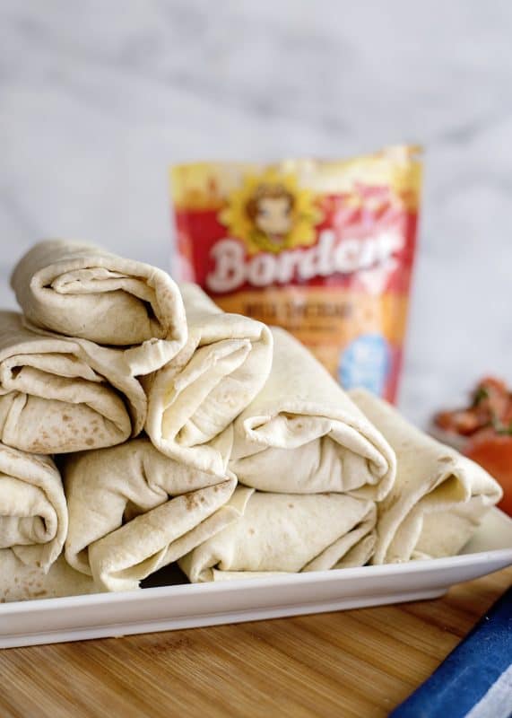 platter of beef and bean burritos.