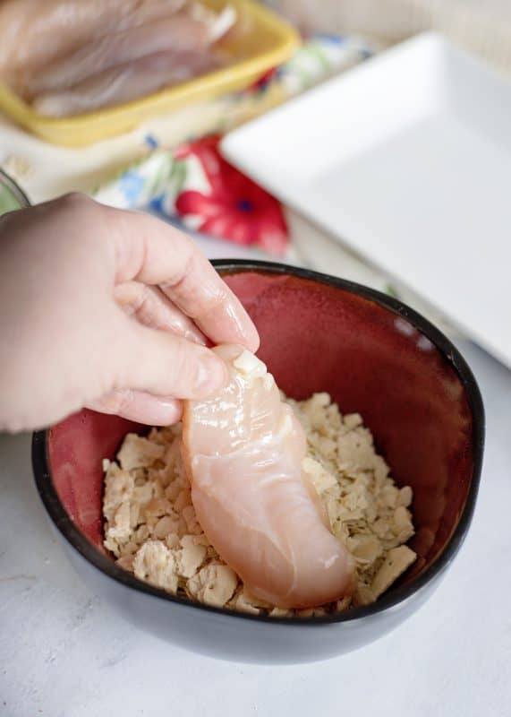 Then press chicken strips into cracker mixture.