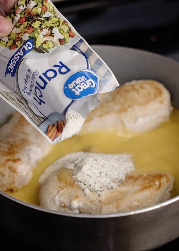 Add cream of chicken soup and ranch dressing to skillet.