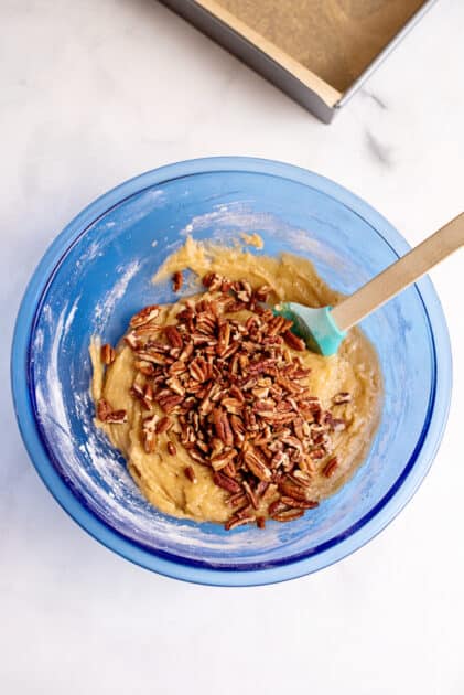 Add pecans and vanilla to mixing bowl.