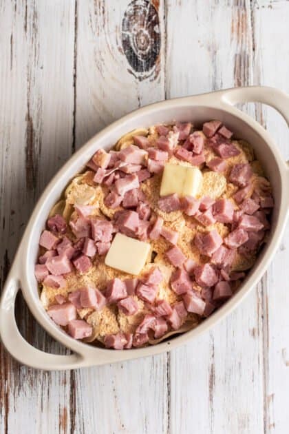 Add chopped ham to casserole dish.