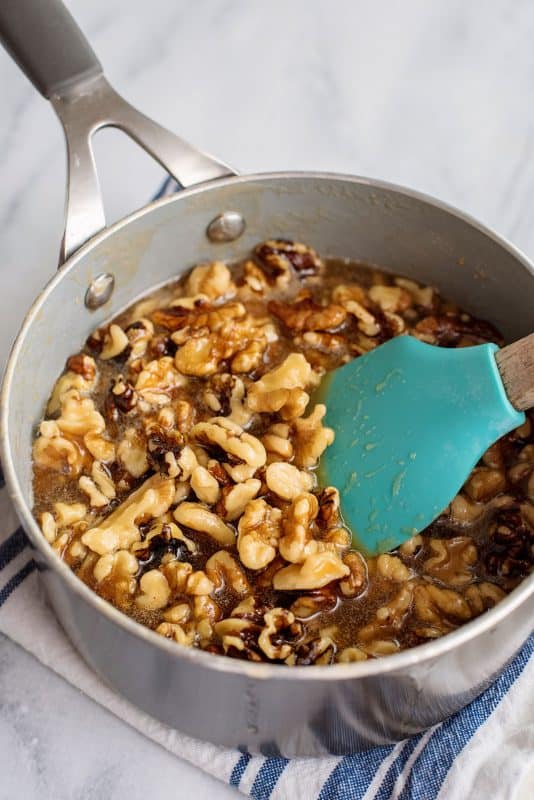 Stir in vanilla and nuts and allow them to cool.