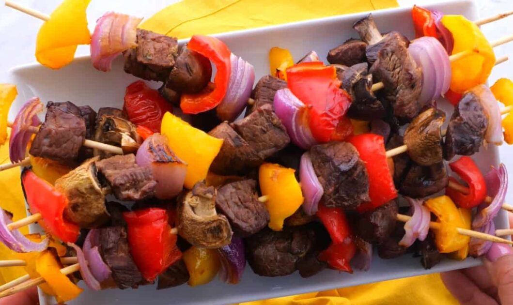 Plate of steak kabobs in beef kabob marinade.