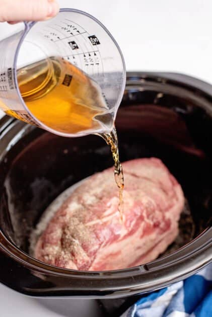 Add cider vinegar to crock pot.