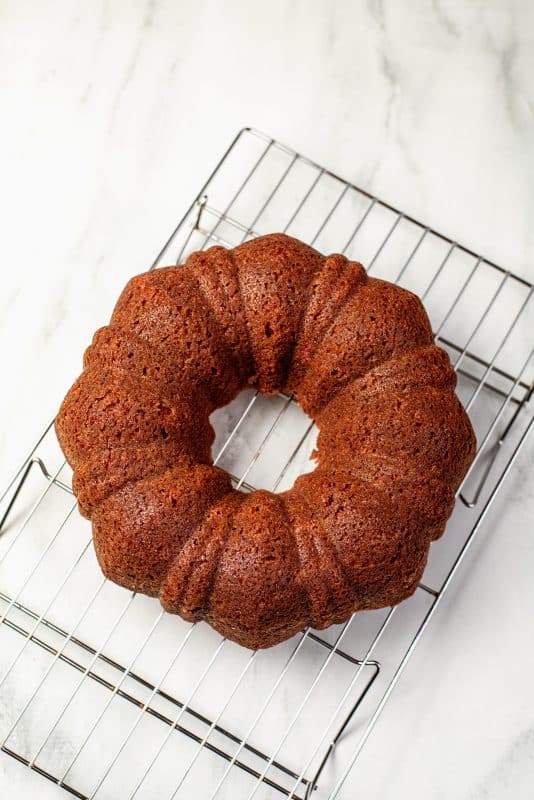 cool bundt cake on a wire rack.