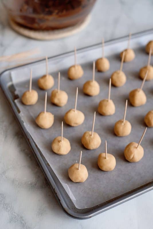 Add toothpicks to refrigerated balls of dough.