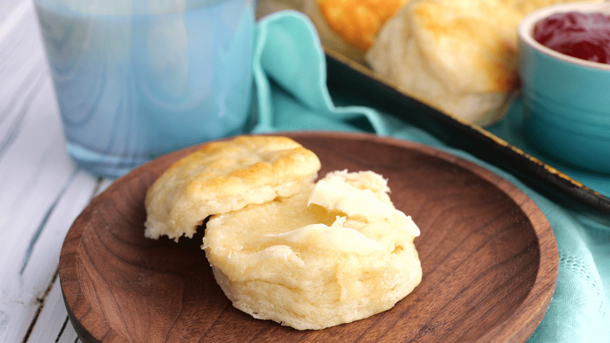 Buttermilk biscuit spread with butter.