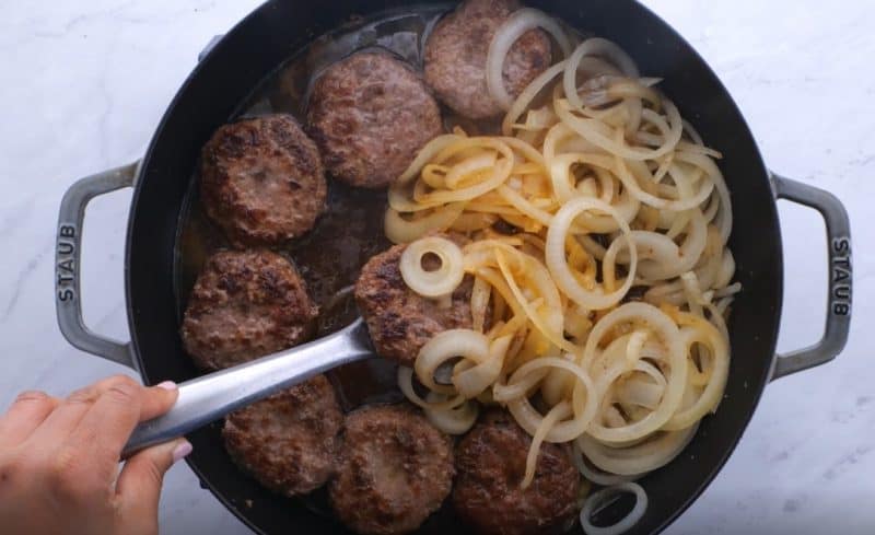 onions brown on the edges and hamburgers cooked through