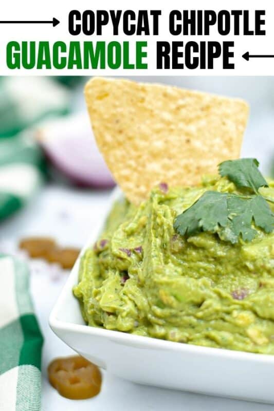 guacamole with chip in it on table 