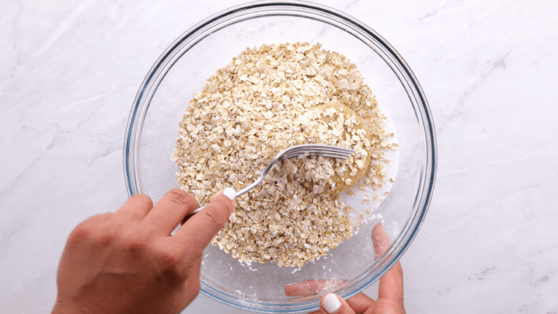 Mixing rhubarb crisp topping ingredients