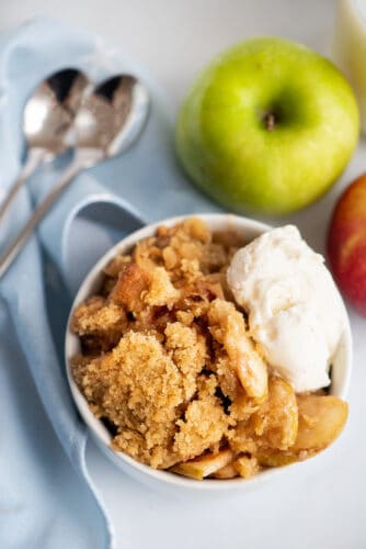 Apple crisp and scoop of vanilla ice cream