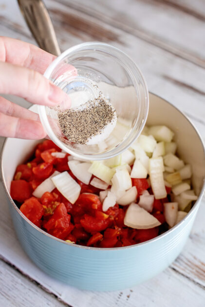 Add salt and pepper to pot.