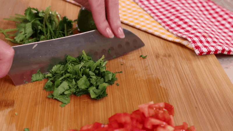 Roughly chopping cilantro for pico de gallo.