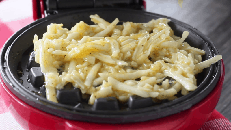 Cheese mixture in mini waffle maker.