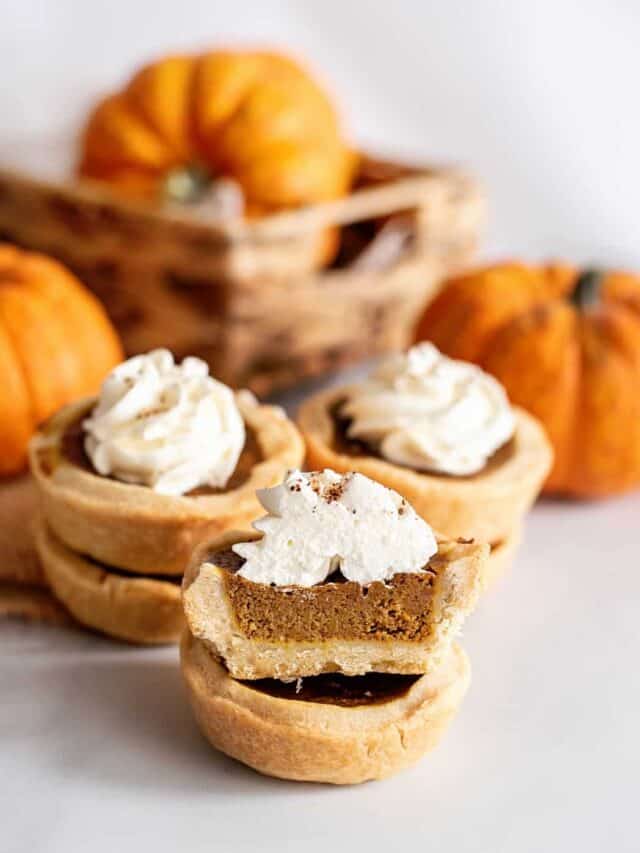 Stack of mini pumpkin pies.