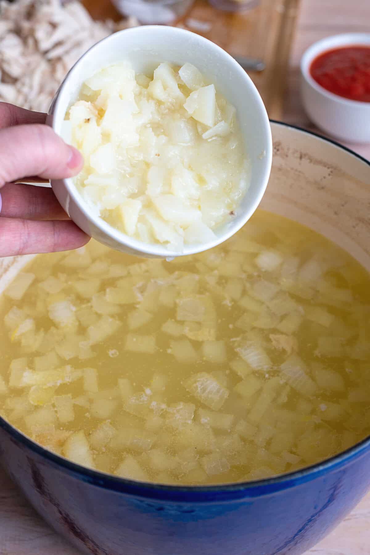 Add mashed potatoes to pot