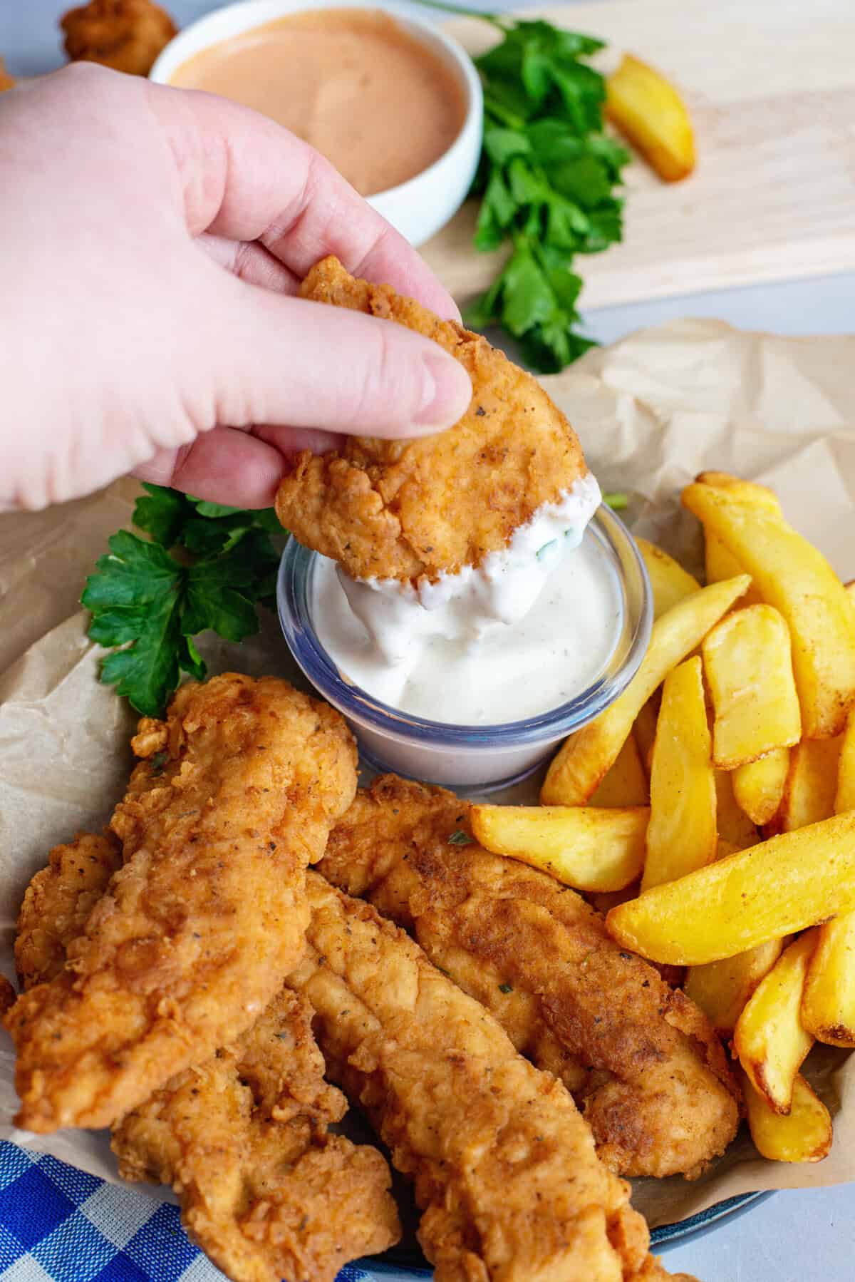 Ranch Fried Chicken Tenders dipped in sauce