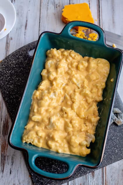 Pour mac and cheese into baking dish.