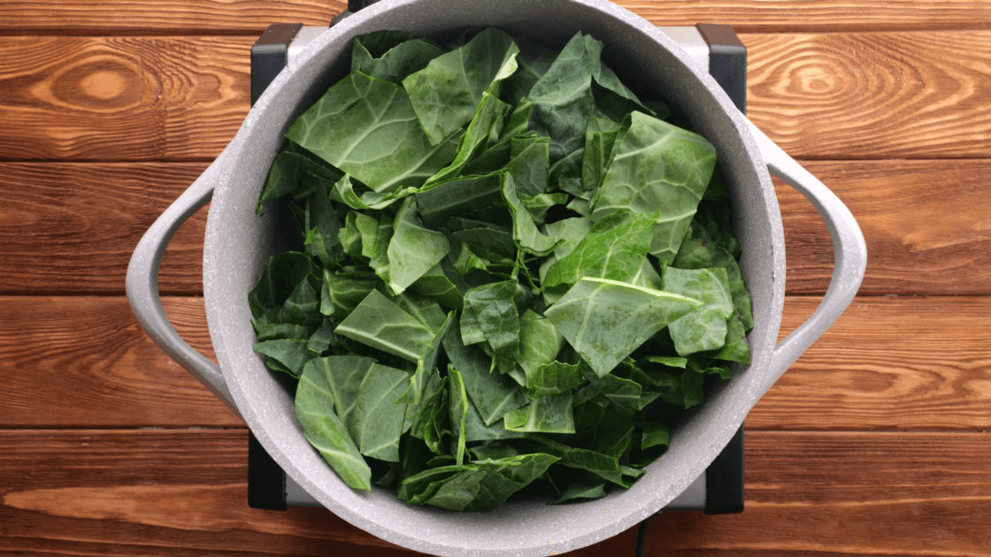 Place collard greens in a large pot.
