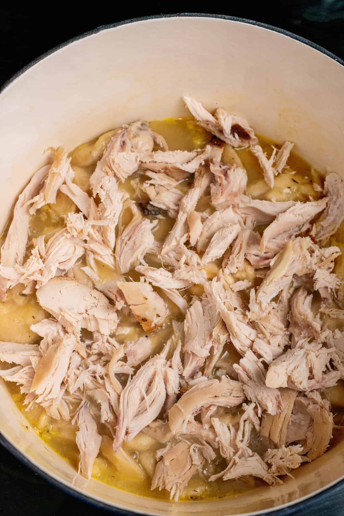 add chicken into dumpling broth mixture