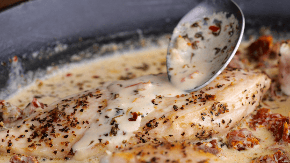 Add cooked chicken to skillet and cover in the sauce.