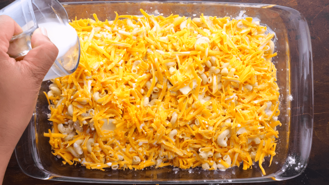 Pour milk over entire mac and cheese casserole.
