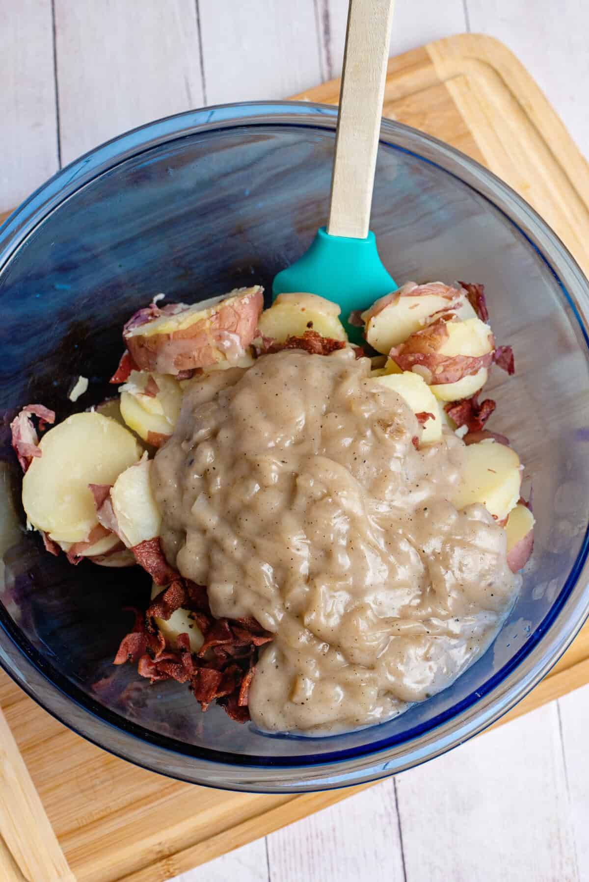 pour the dressing over the best German potato salad