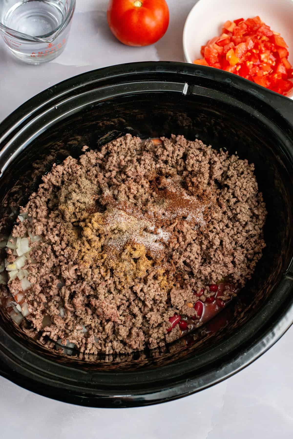 Add ground beef to crock pot.