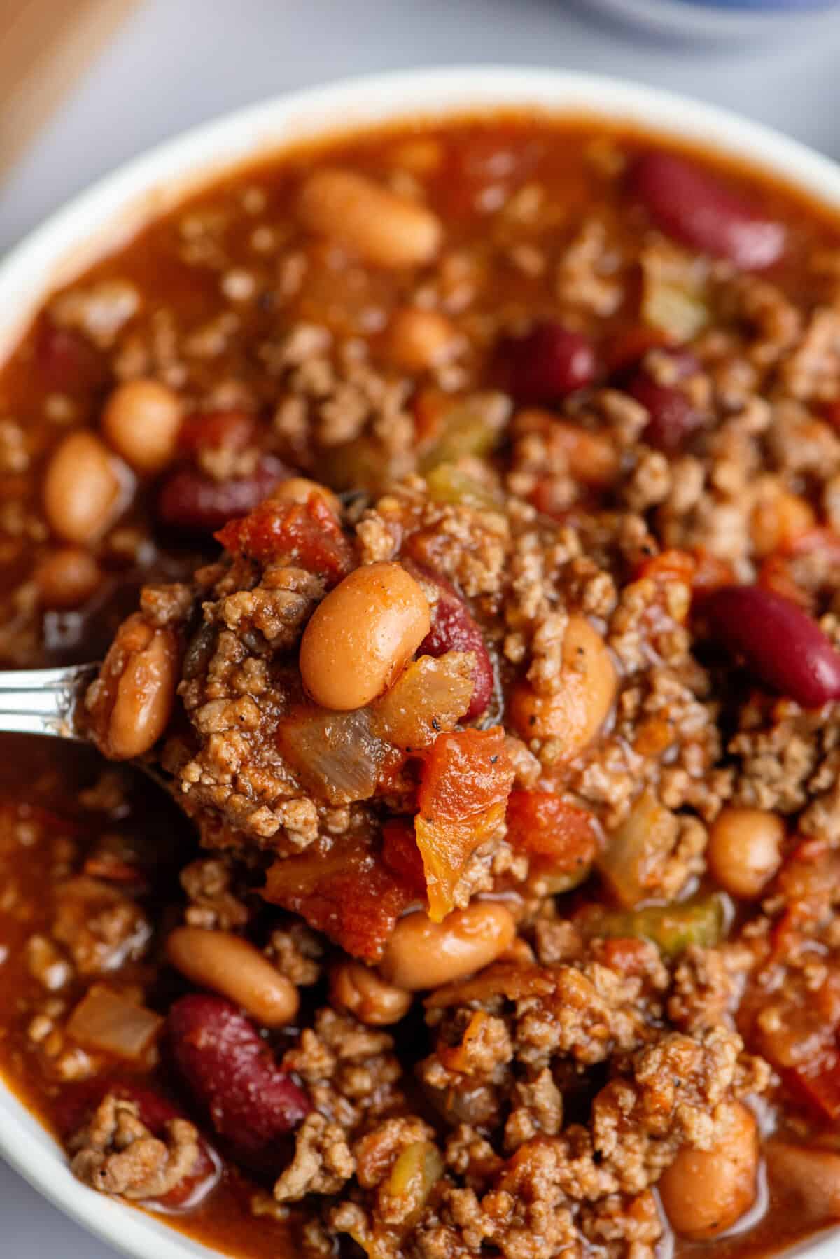 Crock Pot Chili close up on a spoon.