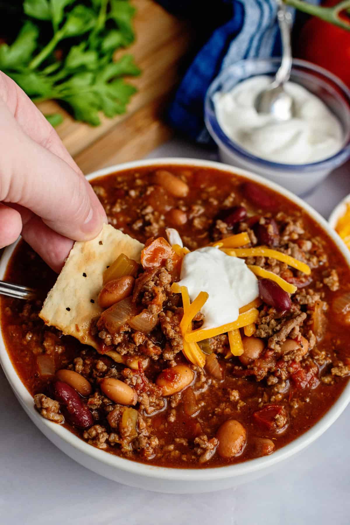 Serve Crock Pot Chili with cheese, sour cream and saltine crackers.