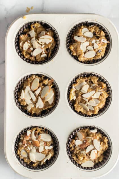 Sprinkle almond flakes on top of muffins before baking.