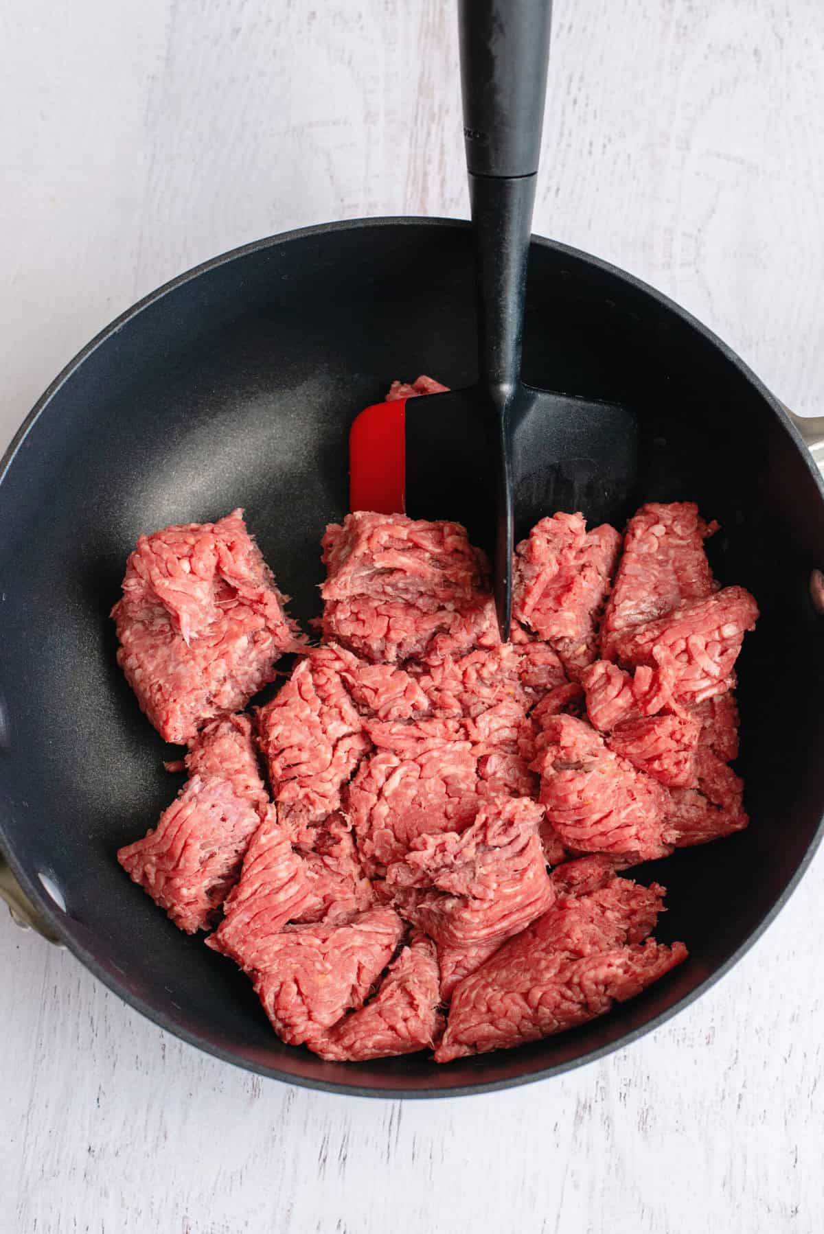 Brown ground beef.