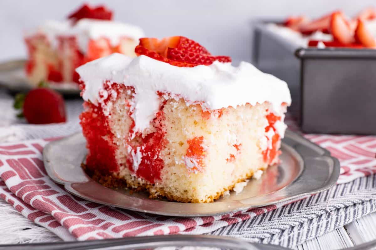 Slice of strawberry poke cake.