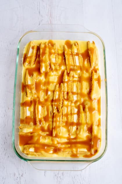 Zigzag caramel over baking dish in morning.