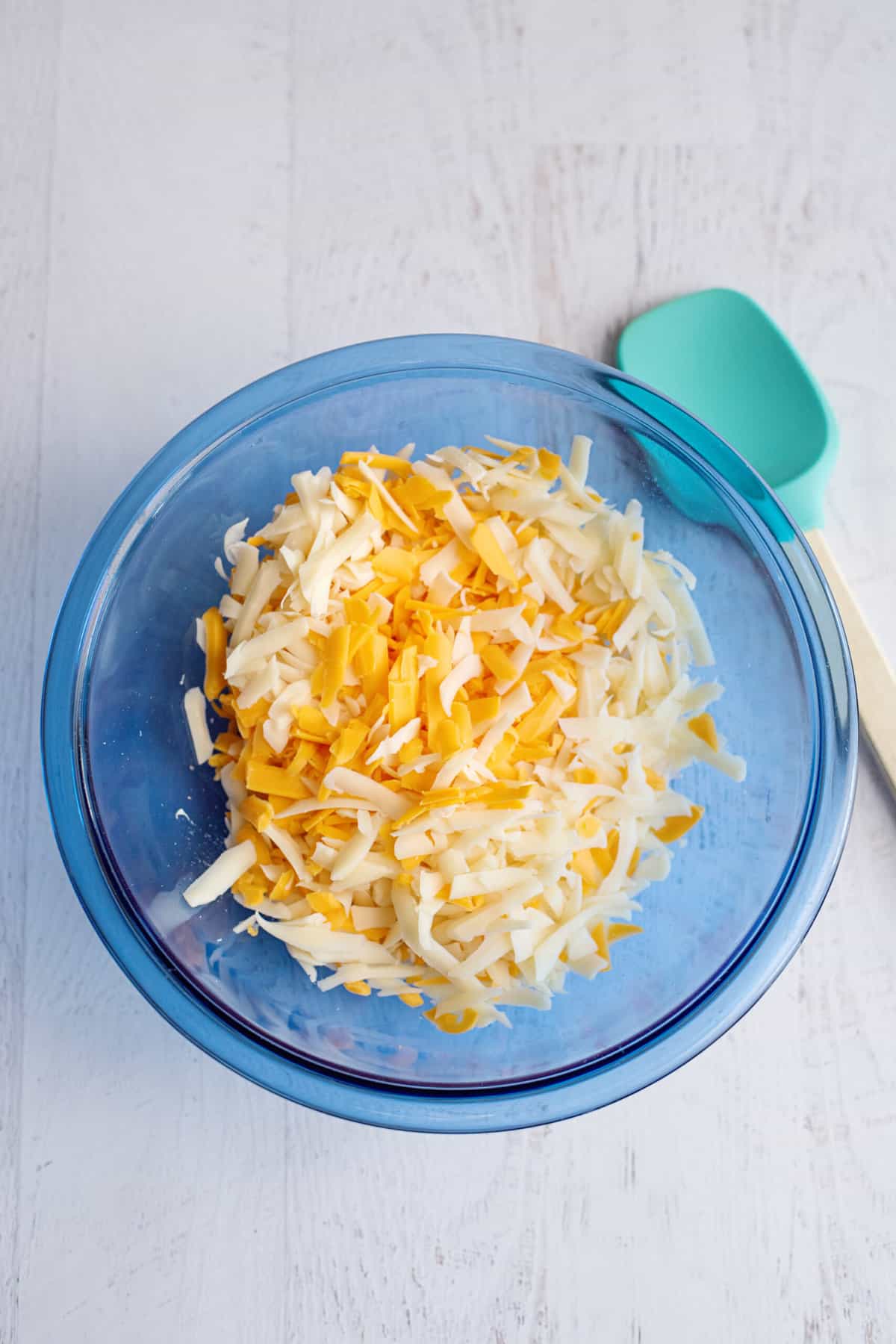 Place chopped onion and cheese into bowl with cream cheese.