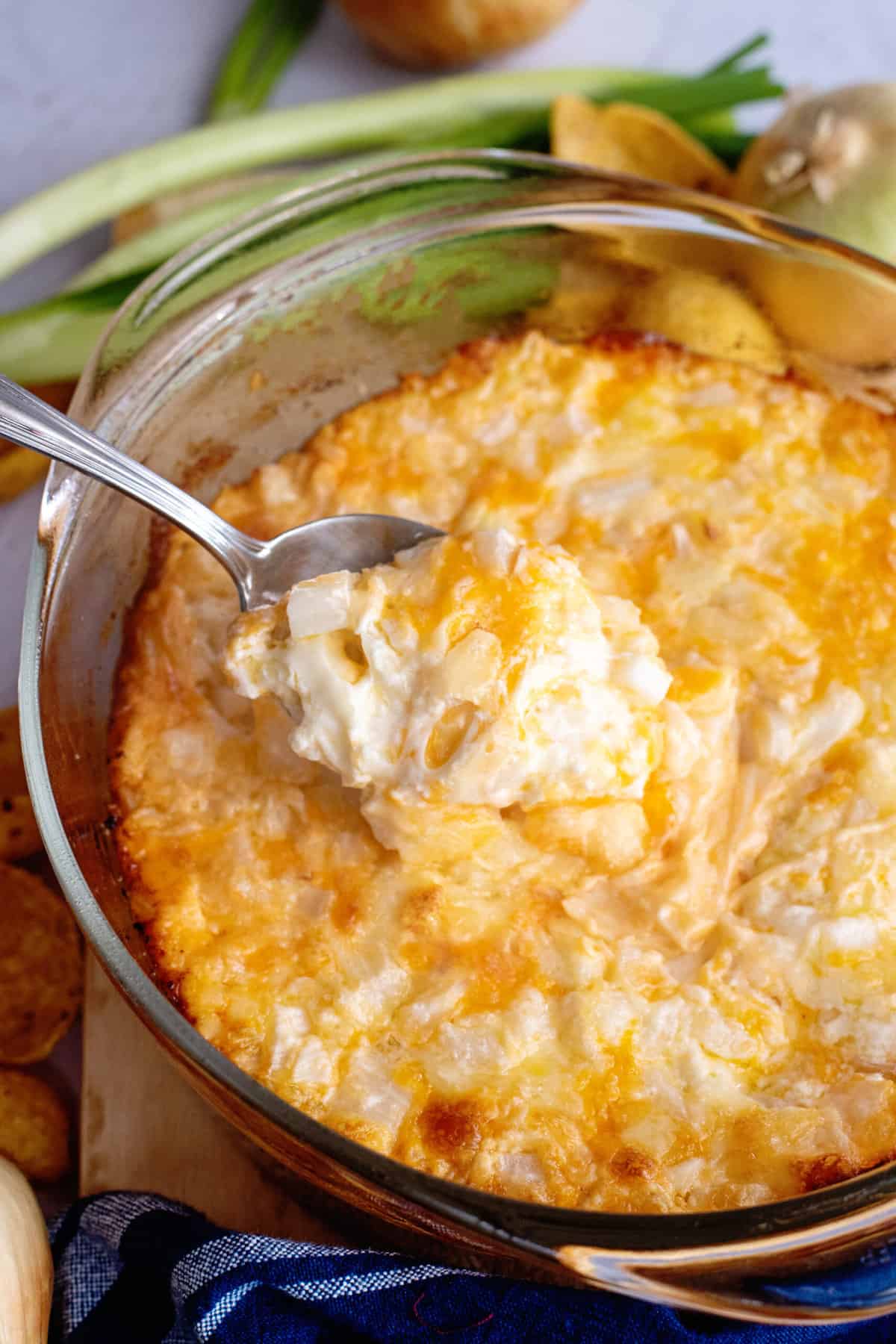 Spoonful of cheesy baked onion dip.