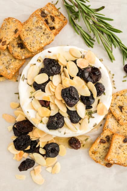 Honey-baked brie surrounded by crackers.