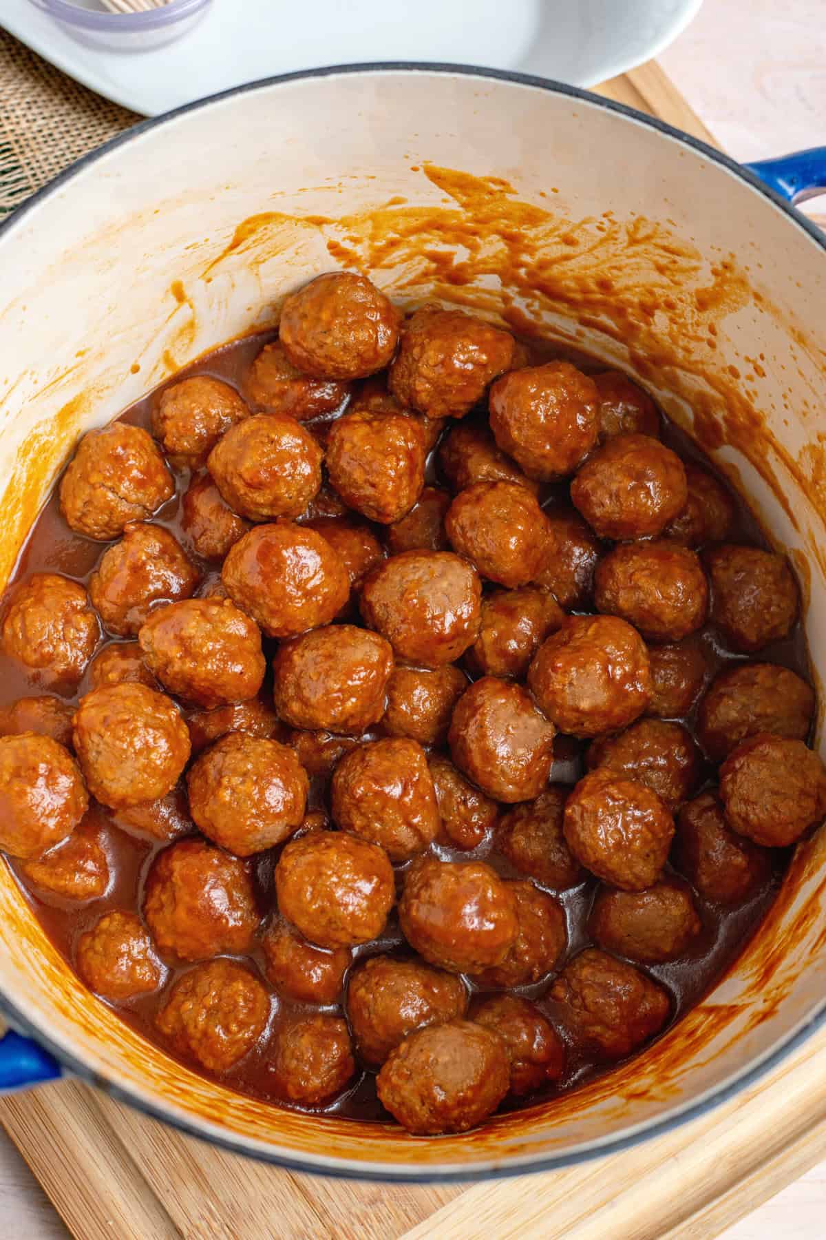 Cook meatballs gently stirring