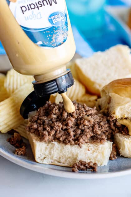 Add condiments like mustard to loose meat sandwiches.