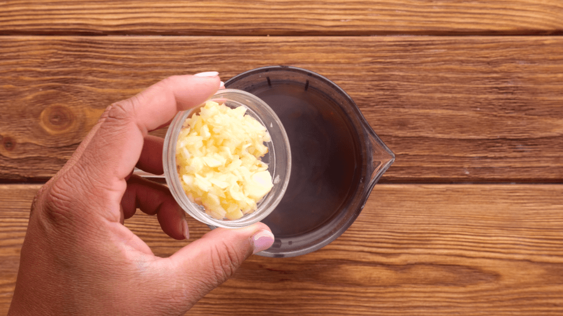 Add garlic to measuring cup.