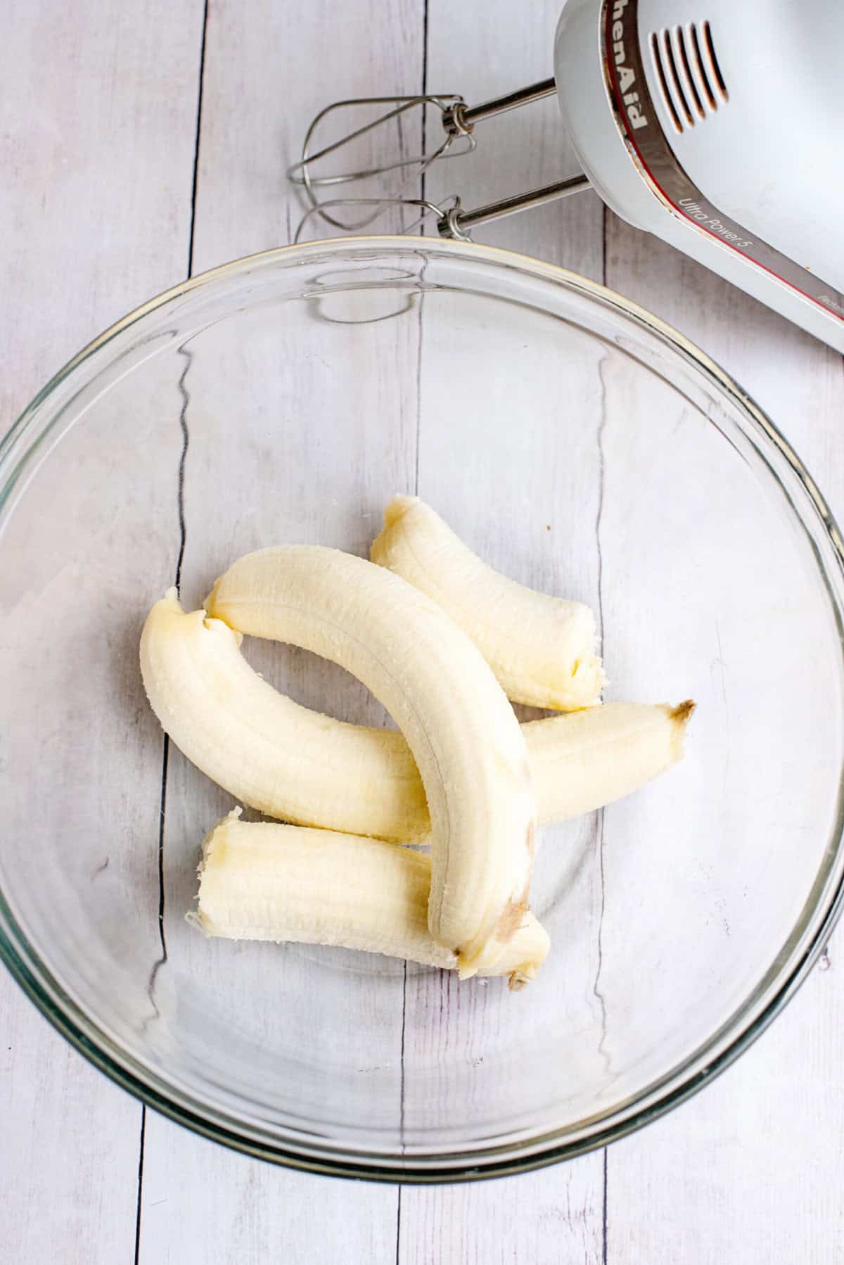 Peel bananas and add to bowl to mash